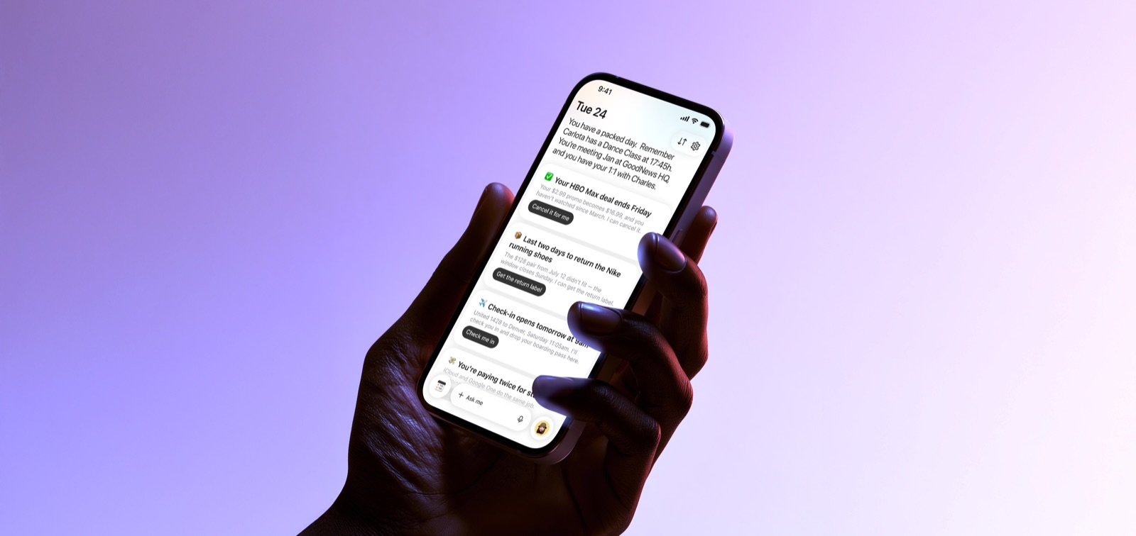 A hand holding a phone showing Oriel’s daily briefing — nudges to cancel an HBO Max promo, return a pair of Nike shoes, and check in for a flight